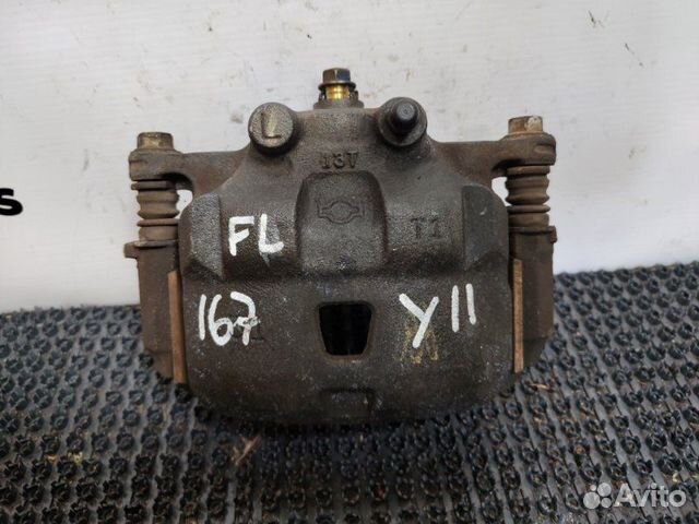 Суппорт тормозной передний левый Nissan Wingroad