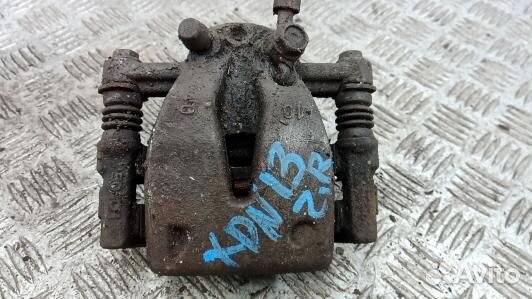 Суппорт тормозной задний правый toyota avensis T25