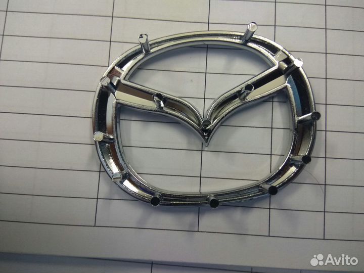 Эмблема мазда