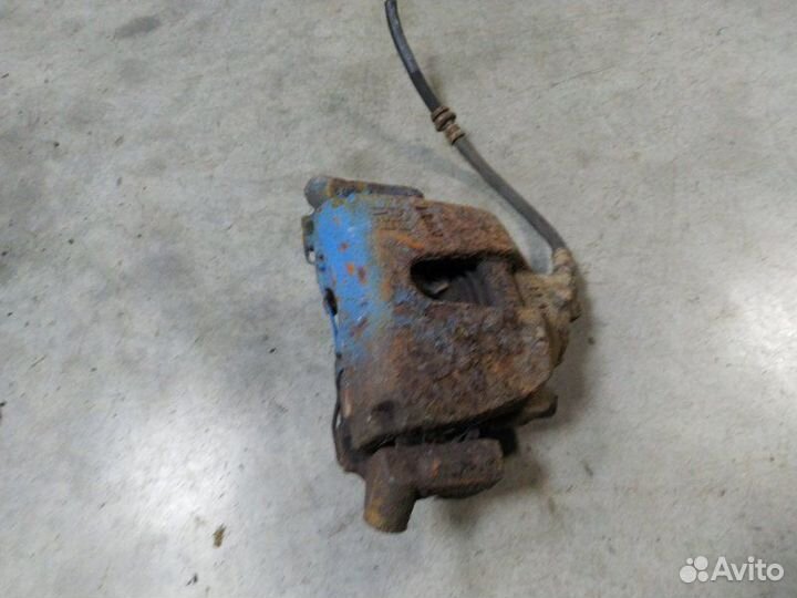 Суппорт тормозной передний левый Mazda 3 седан 2.0