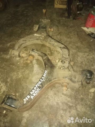 Передние рычаги Сан Енг Кайрон 2.3 2013г(зад.прив)