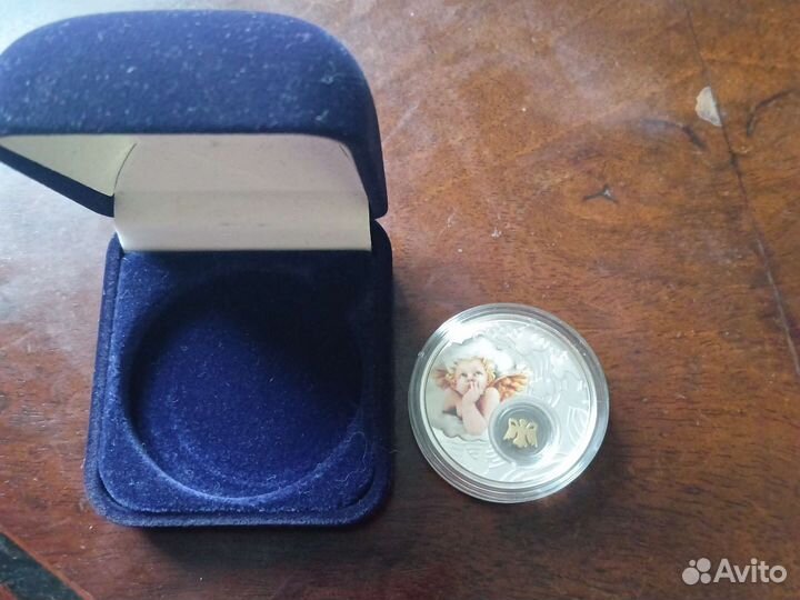 Монета ниуэ Ангел