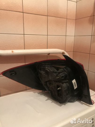 Фонарь задний Логан