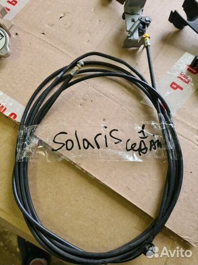 Тросик багажника Hyundai Solaris седан 2011