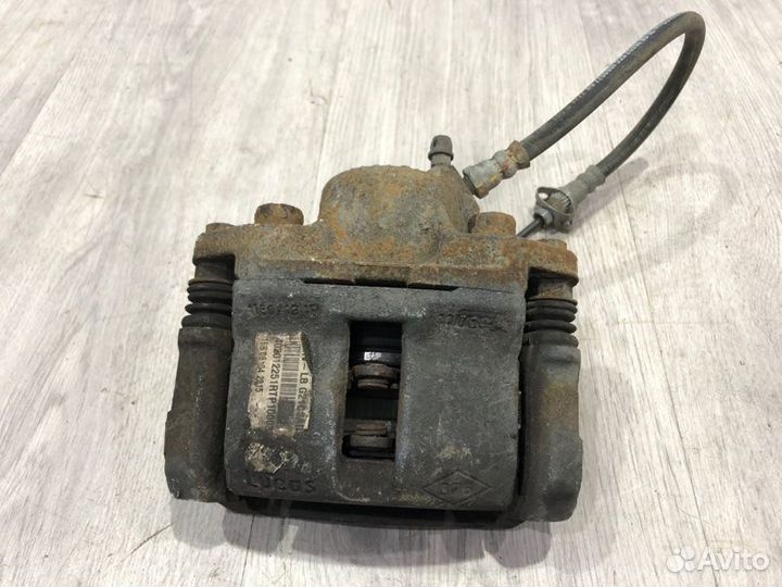 Суппорт тормозной передний левый Renault Logan