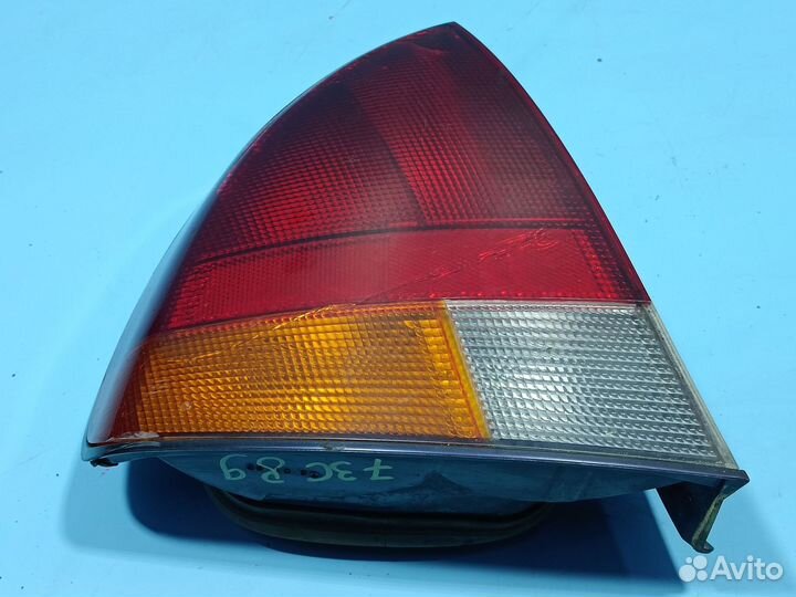 Фонарь левый наружный для Mitsubishi Carisma