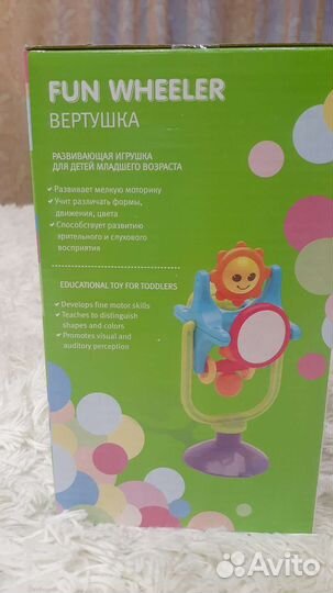 Развиваюшая игрушка вертушка на присоске