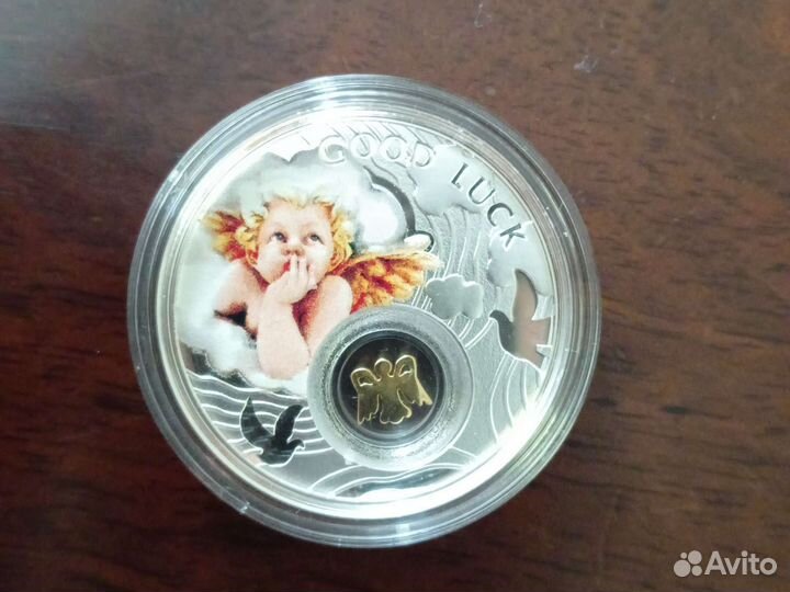 Монета ниуэ Ангел