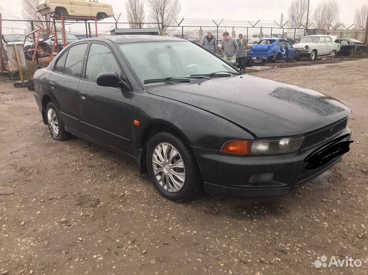 Суппорт передний левый Mitsubishi Galant 8