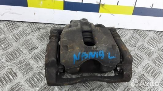 Суппорт тормозной передний левый nissan note E11