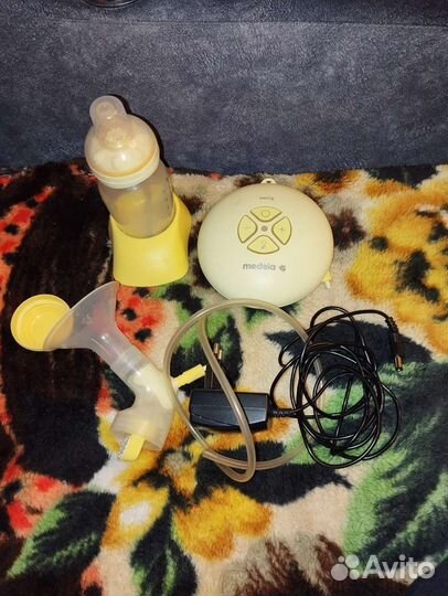 Молокоотсос medela электрический
