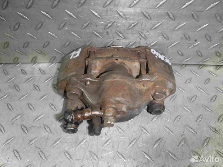 Суппорт тормозной передний левый Mazda Demio