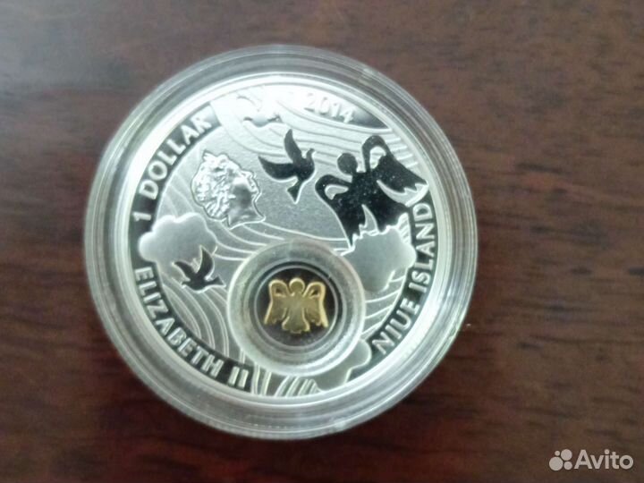 Монета ниуэ Ангел