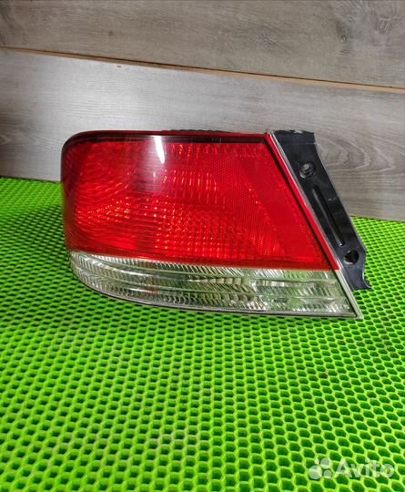 Фонарь задний левый Mitsubishi Lancer