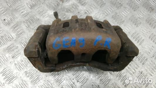 Суппорт тормозной передний правый mitsubishi outla