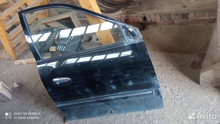 Двери kia carens 2003