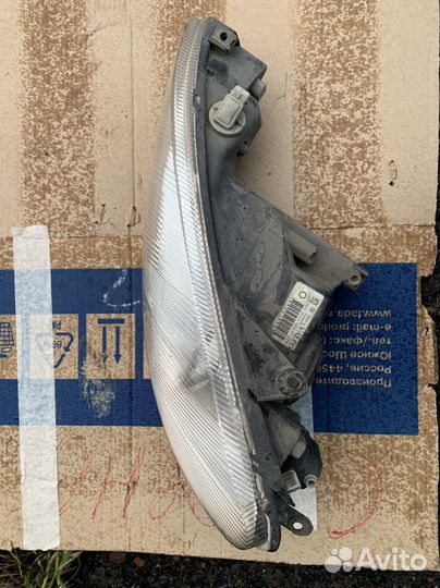 Фара левая Peugeot 206