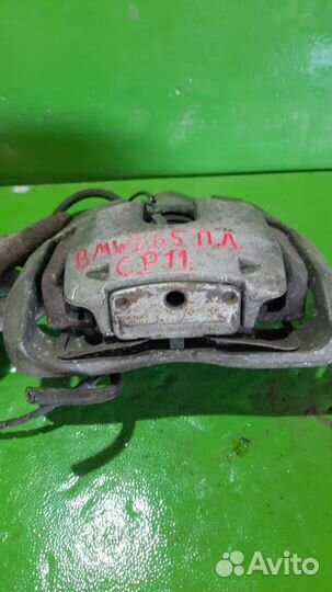 Суппорт тормозной BMW 7-Series слева спереди 34116