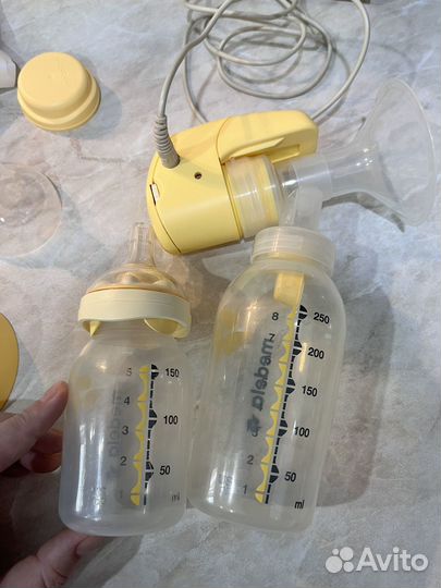 Молокоотсос medela электрический