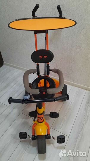 Трехколесный велосипед с ручкой