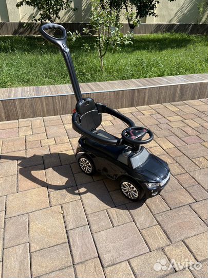 Машинка каталка с ручкой