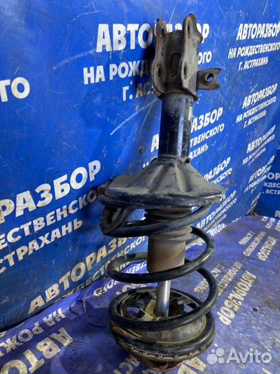 Передняя левая стойка амортизатора Kia Clarus