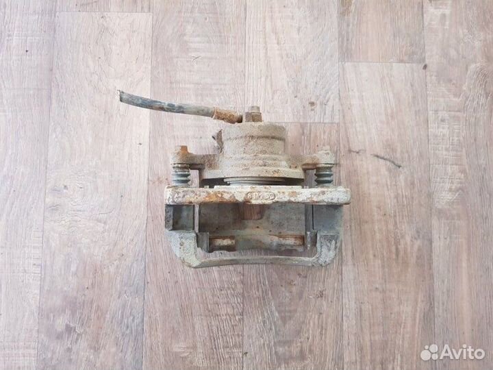 Суппорт тормозной передний левый Chevrolet Lacetti