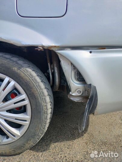 Задний бампер Mazda 323 2003г седан