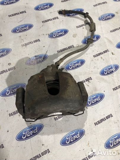 Суппорт тормозной передний левый Ford Focus 2