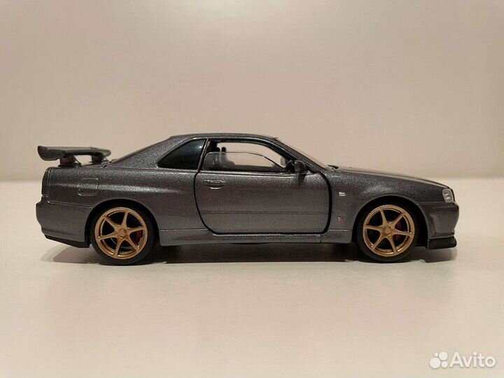 Модель Nissan Skyline R34 GTR масштаб 1:32
