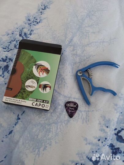 Каподастр для гитары новый