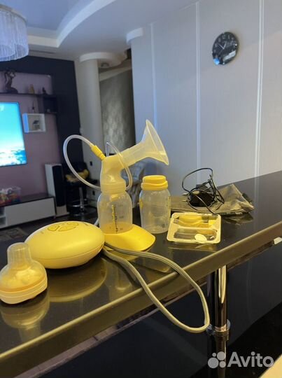Молокоотсос medela электрический
