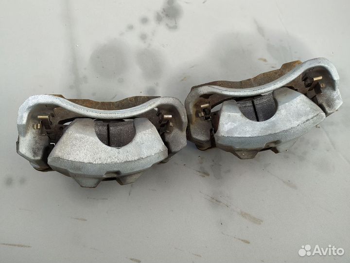 Суппорт тормозной передний Toyota Corolla (E150) X