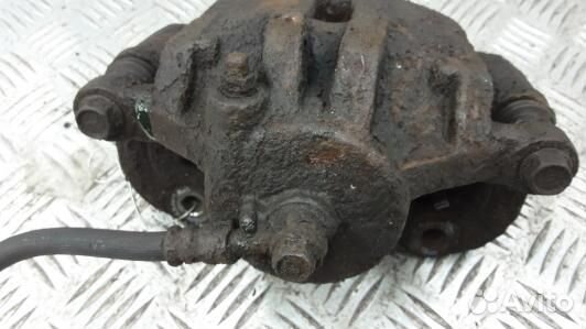 Суппорт тормозной передний левый KIA sportage 2 (1