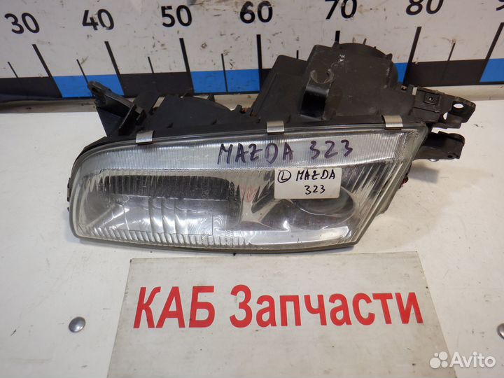 Фара левая Mazda 323