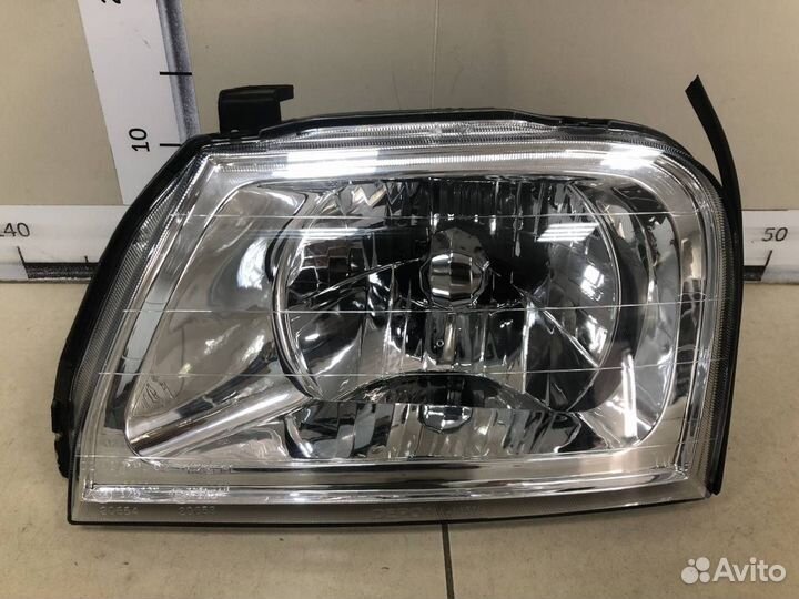 Фара левая Mitsubishi L200 K6,K7 1996-2006