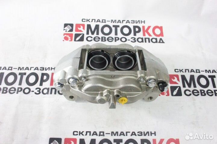 Суппорт тормозной передний левый Toyota Land