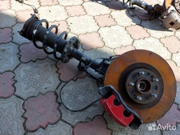 Стойка амортизатора Киа Соренто Прайм