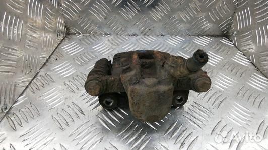 Суппорт тормозной задний левый toyota corolla E12