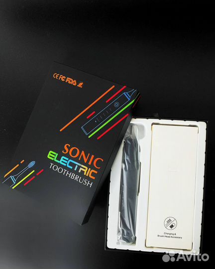 Электрическая зубная щетка