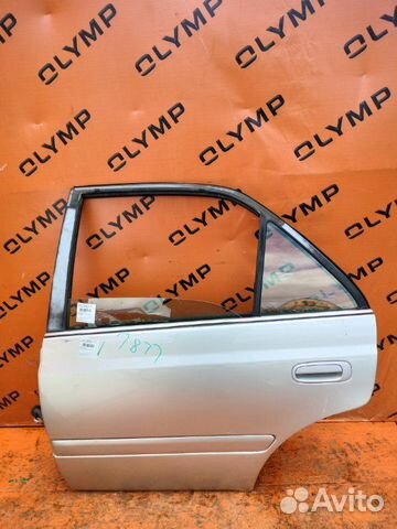 Стекло двери заднее левое Toyota Carina ST215