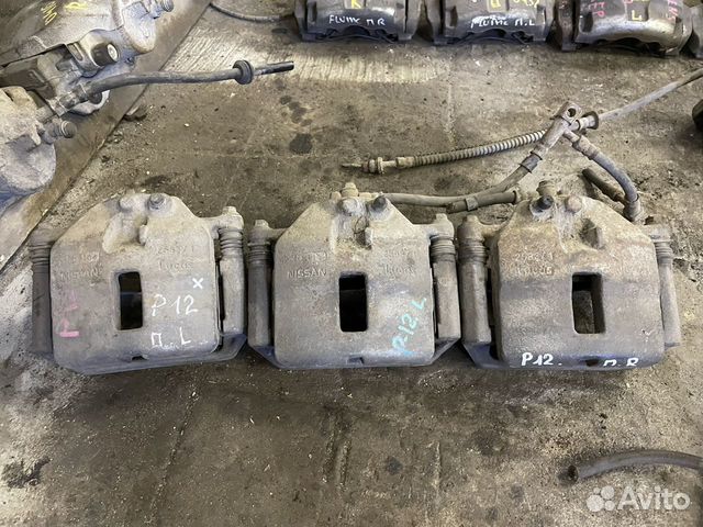 Суппорт передний левый Nissan Primera P12 2