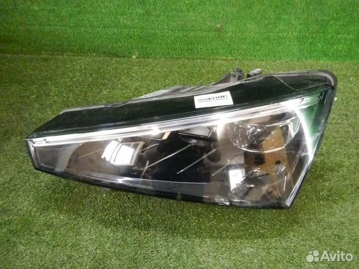 Фара левая Skoda Rapid