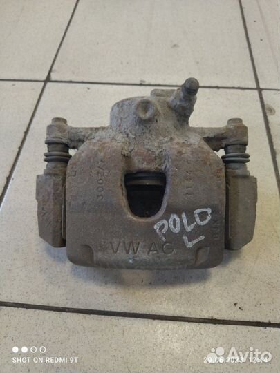 Суппорт тормозной передний левый Volkswagen Polo