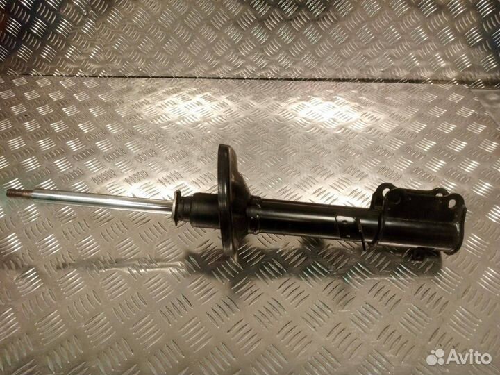 Стойка амортизатора задняя левая Toyota Corolla