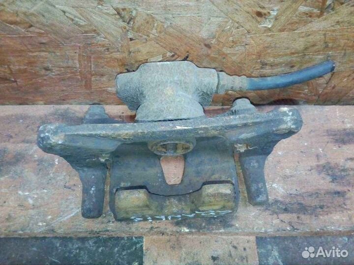 Суппорт задний левый Mitsubishi Grandis NA 2.4