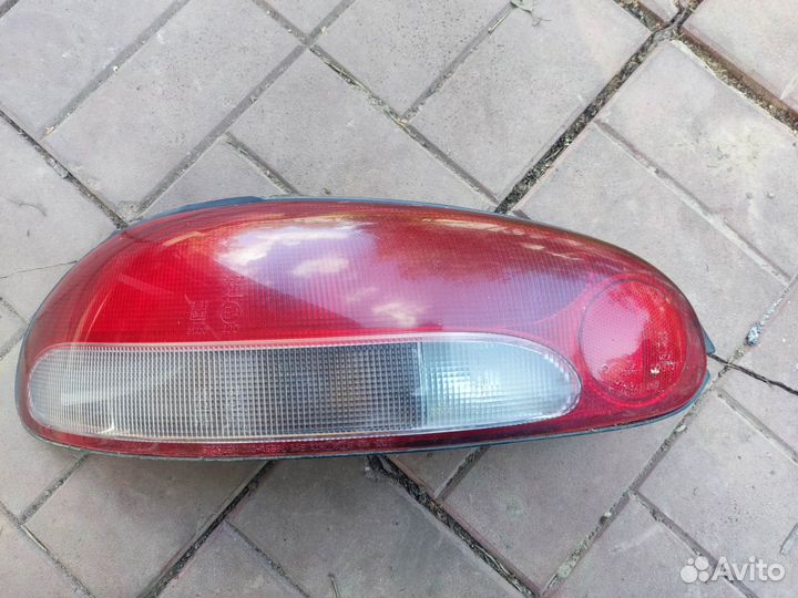 Фонарь левый Mitsubishi Colt CA 4 поколение 92-96