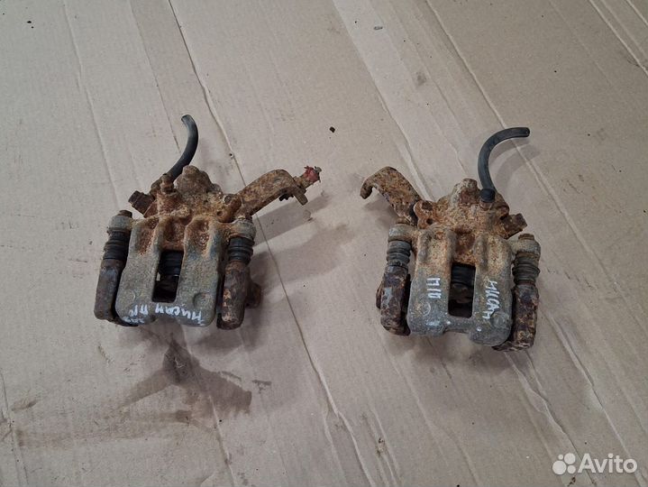 Супорт задний левый (правый) Nissan primera P10