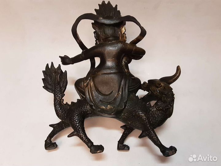 Будда на драконе-единороге.Бронза