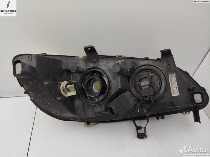 Фара левая 89100054 на Opel Zafira A